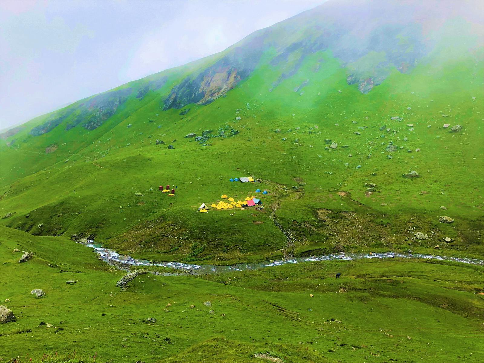 149e3f5c 9010 473a b326 58aa3d421ce2 bhrigu lake trek   brijesh kumar   rola khuli campsite from a distance 